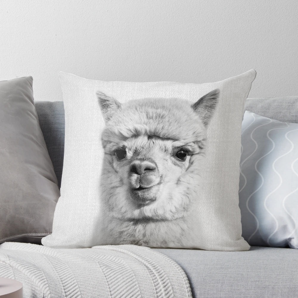 Alpaca-themed black and white decorative throw pillow with a whimsical, nature-inspired design.