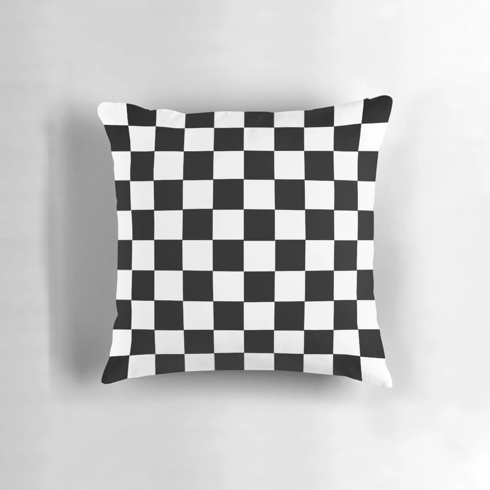 Black and white checkerboard pattern pillow with a classic grid design