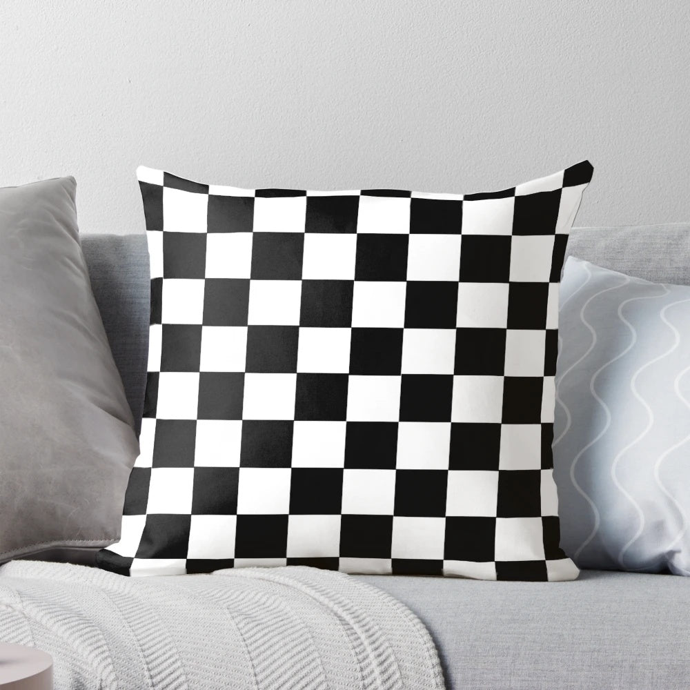 Black and white checkerboard pattern pillow with a classic grid design