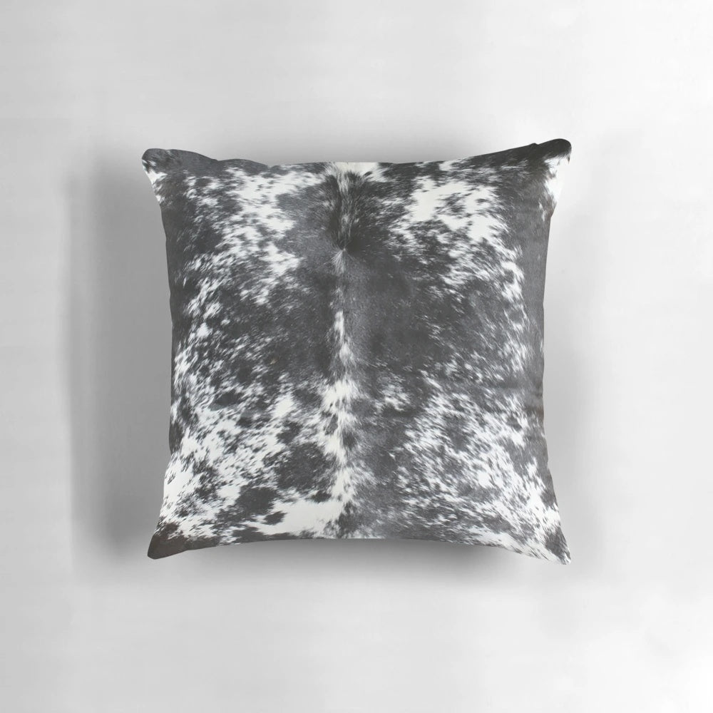 Black and white cowhide patterned accent pillow