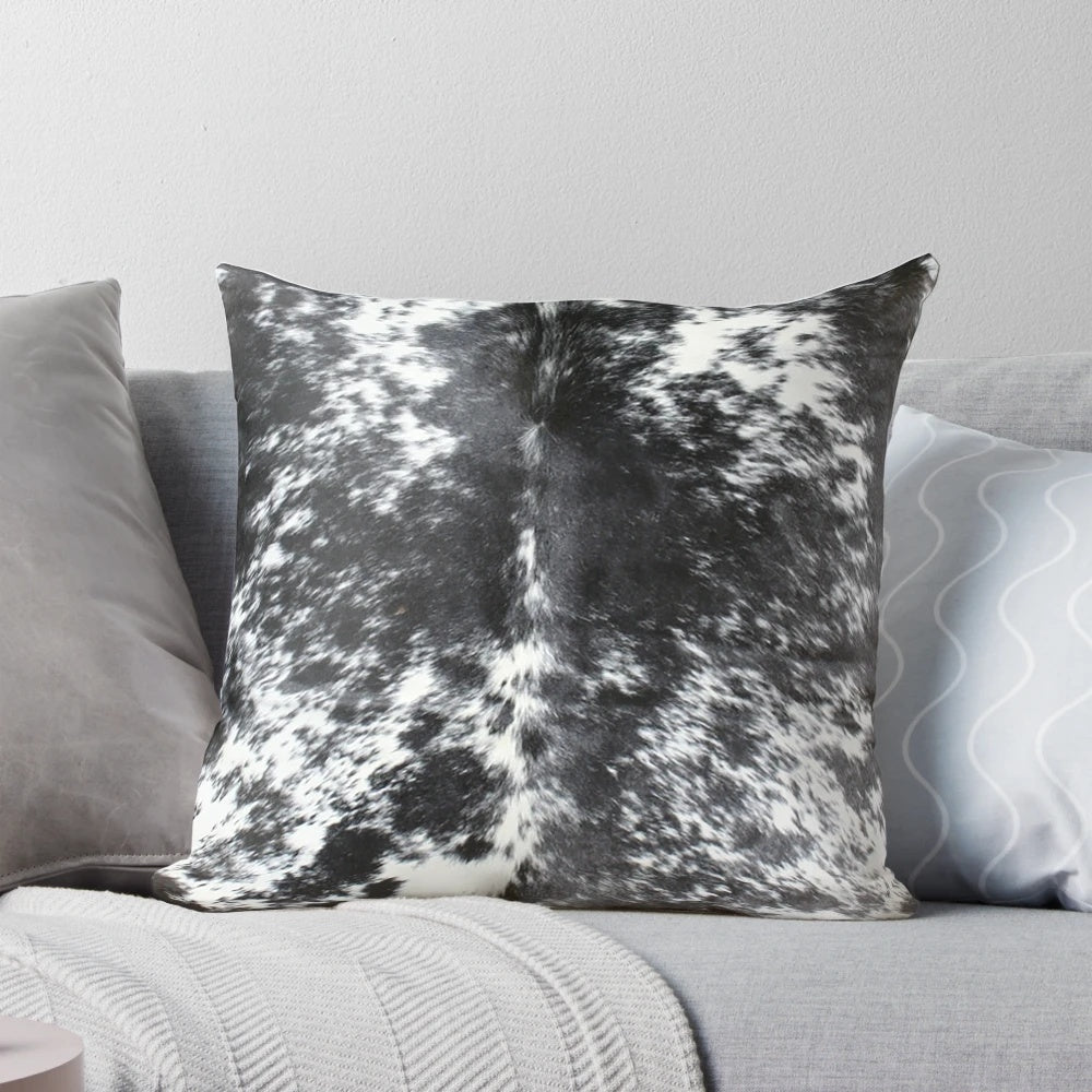 Black and white cowhide patterned accent pillow