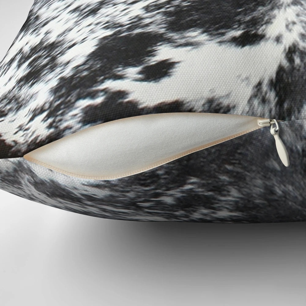 Black and white cowhide patterned accent pillow