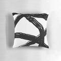 Elegant black and white throw pillow with a modern, minimalist design