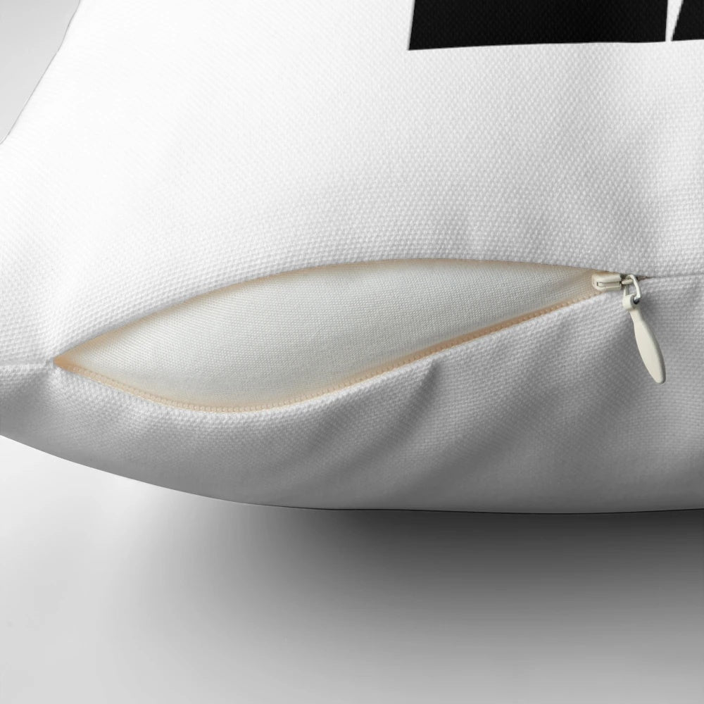 Black and white pillow with sneaker-inspired design