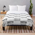 Black and white plush blanket with Trapstar-inspired design