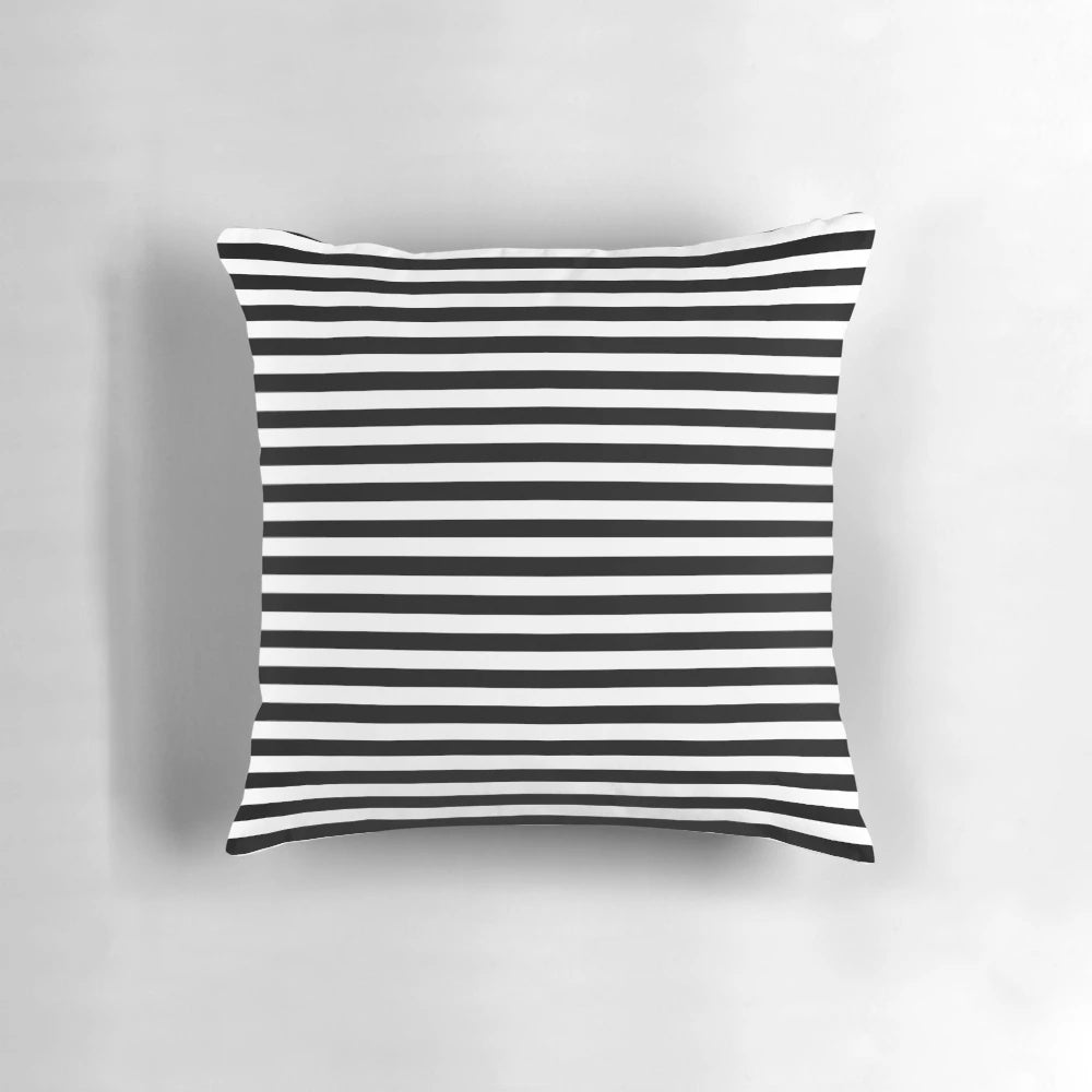 Black and white striped decorative pillow with modern, minimalist design
