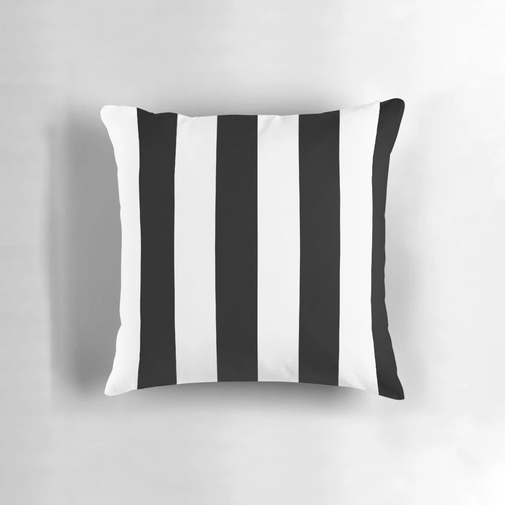 Black and white vertical striped pillow with a minimalist, modern design