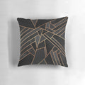 Black and copper geometric pattern pillow with abstract lines and shapes