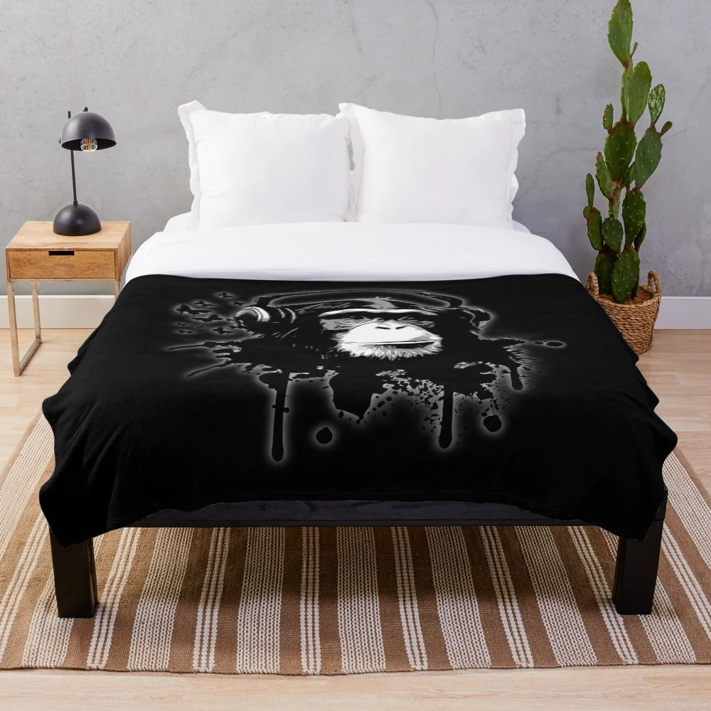 Black plush blanket with abstract monkey graffiti design