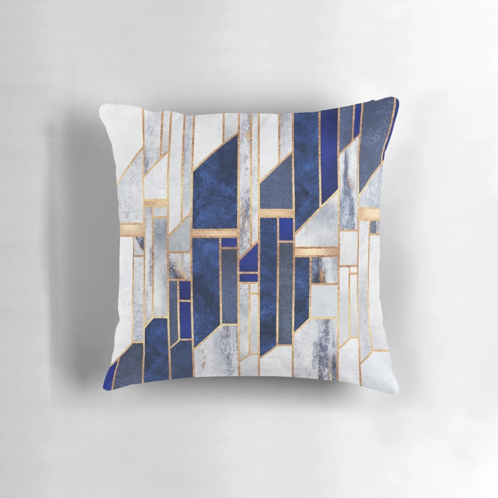Blue and gold geometric pillow with modern abstract design