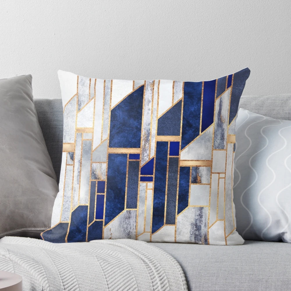 Blue and gold geometric pillow with modern abstract design