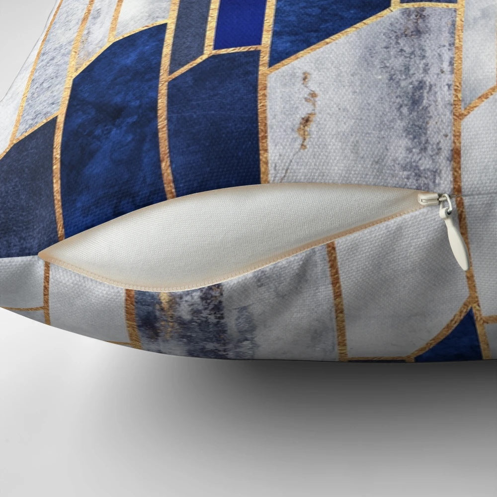 Blue and gold geometric pillow with modern abstract design