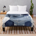 Blue and grey geometric patterned plush blanket