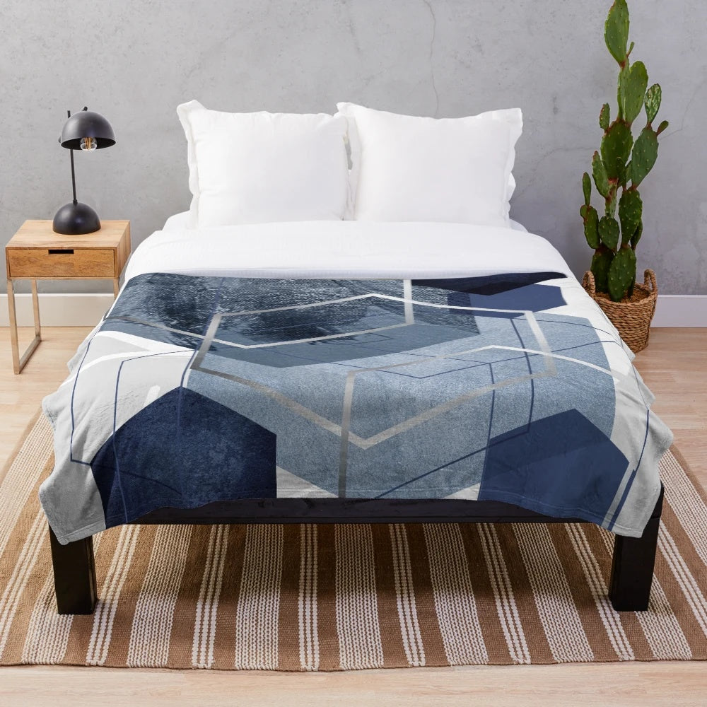Blue and grey geometric patterned plush blanket