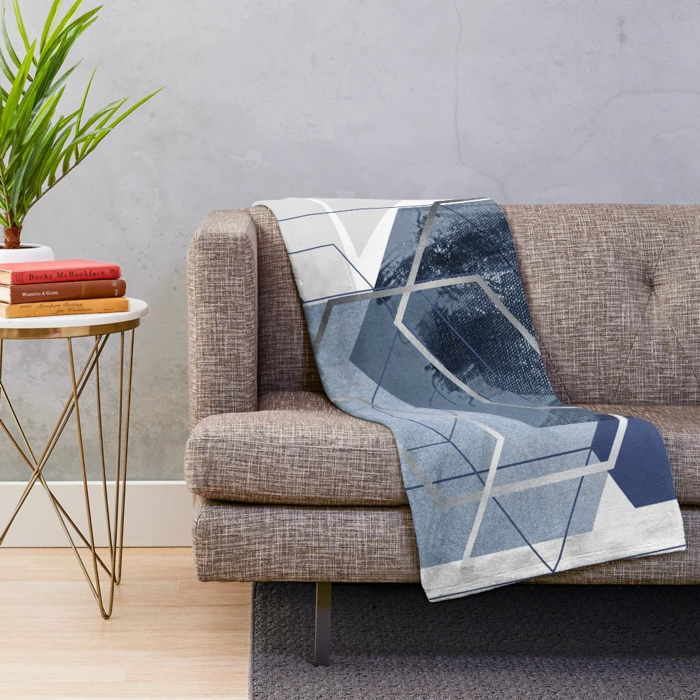 Blue and grey geometric patterned plush blanket