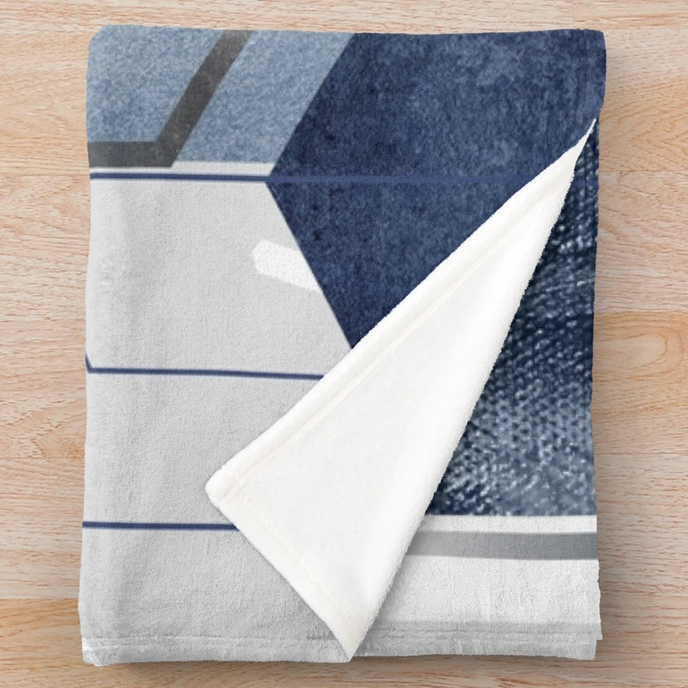 Blue and grey geometric patterned plush blanket