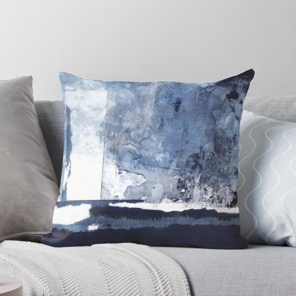 Blue and white abstract art pillow with a modern, minimalist design
