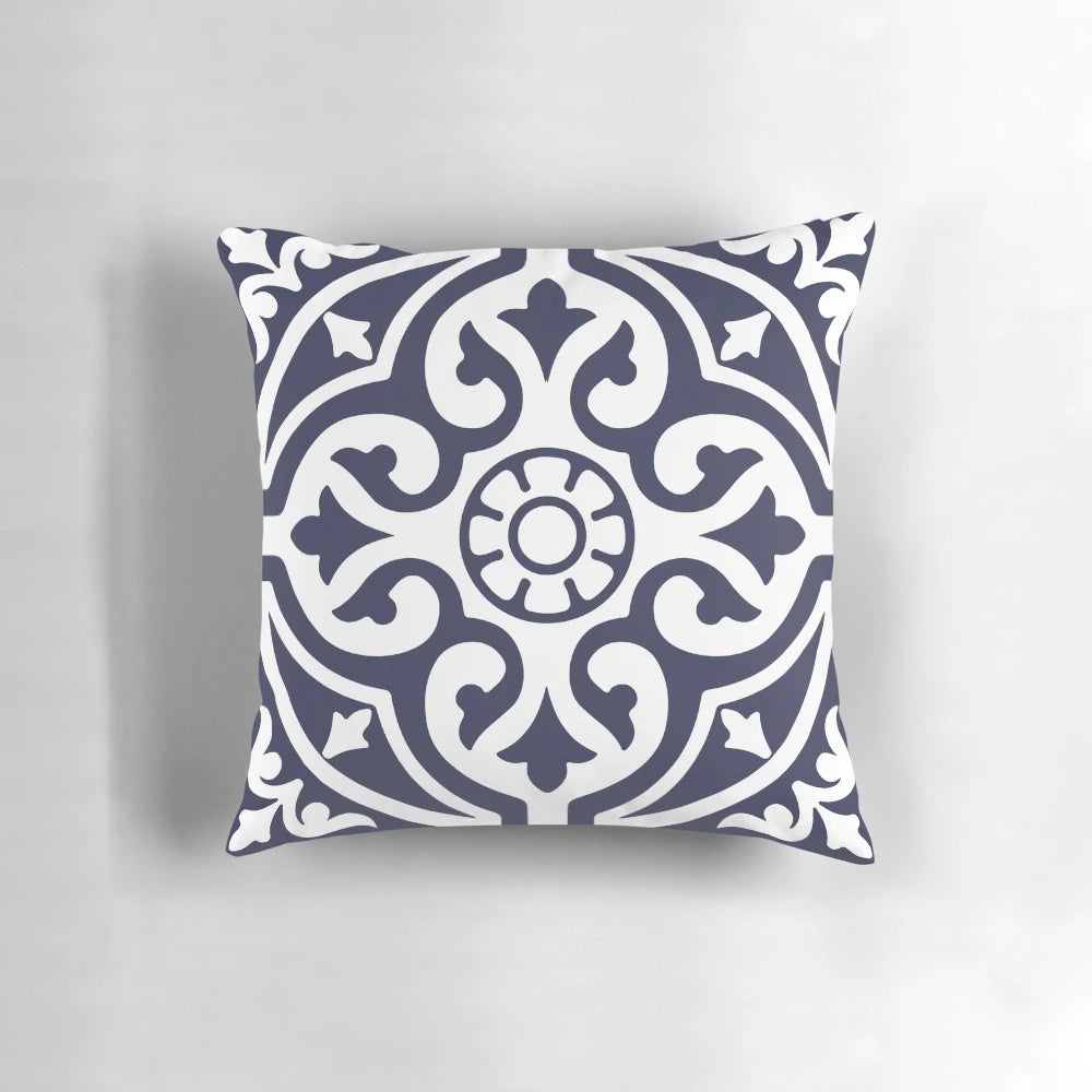Blue and white patterned pillow with Moroccan-inspired trellis design