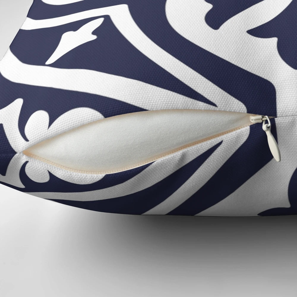Blue and white patterned pillow with Moroccan-inspired trellis design