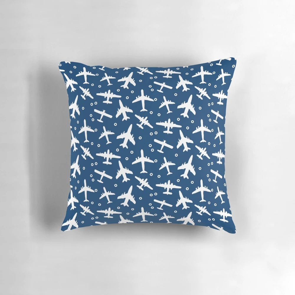 Blue and white decorative pillow with a silhouette pattern of aeroplanes