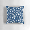 Blue and white decorative pillow with a silhouette pattern of aeroplanes