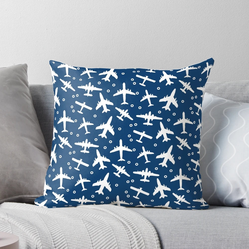 Blue and white decorative pillow with a silhouette pattern of aeroplanes