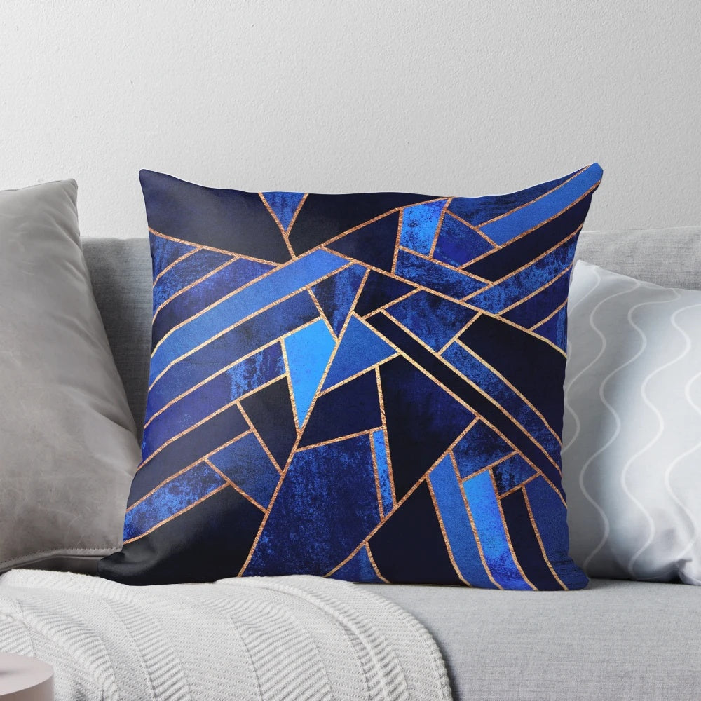 Blue geometric throw pillow with abstract mosaic pattern