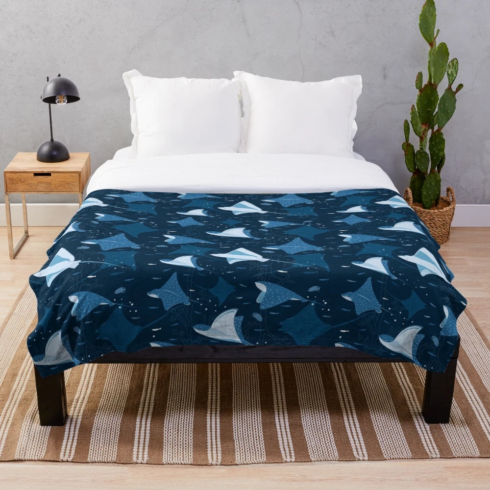 Blue plush blanket with a stylish stingray pattern design
