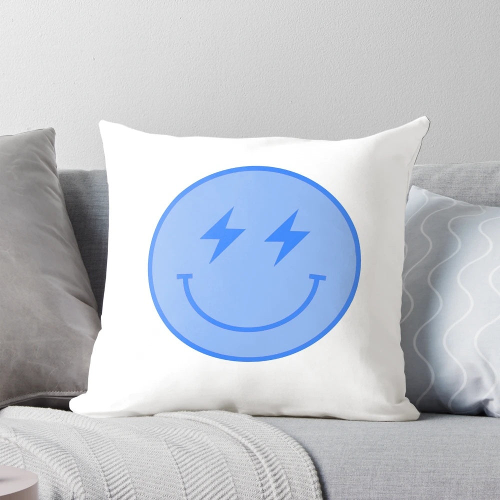 Blue smiley face pillow with lightning bolt design