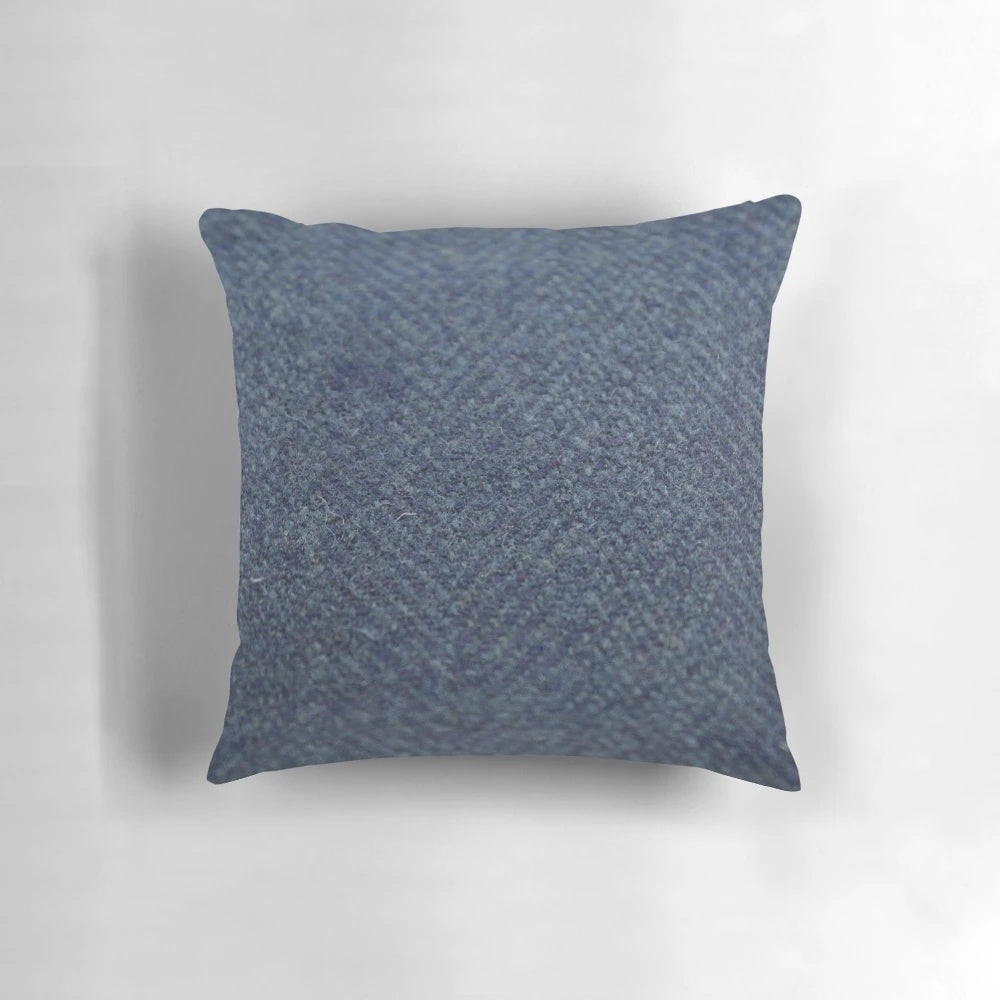 Blue tweed pillow with herringbone pattern, a stylish and cozy gift for fathers and brothers.