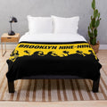 Brooklyn Nine Nine inspired plush blanket featuring a stencil-style wallpaper design