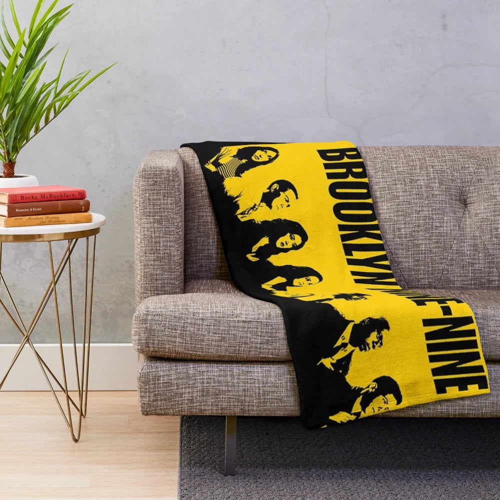 Brooklyn Nine Nine inspired plush blanket featuring a stencil-style wallpaper design