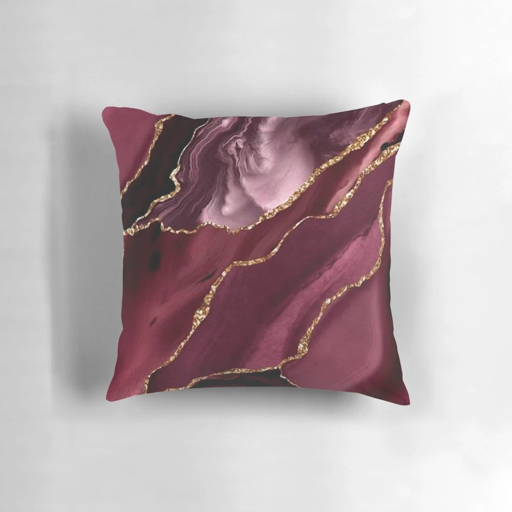 Burgundy and gold abstract patterned decorative pillow