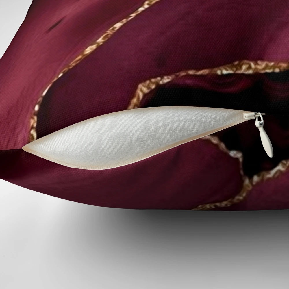 Burgundy and gold abstract patterned decorative pillow