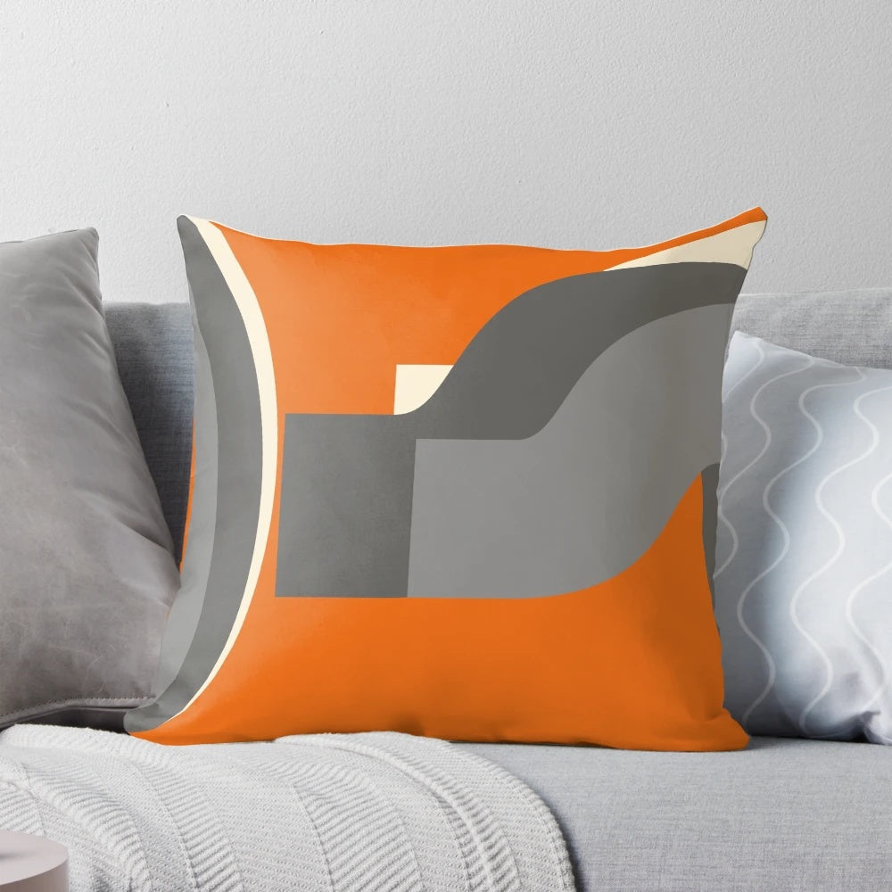 Burnt orange retro-style pillow with grey accents, perfect for adding a vintage touch to your living space.