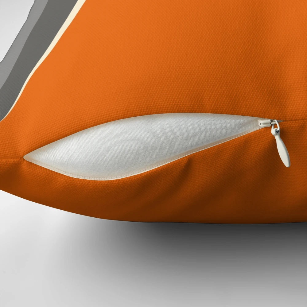 Burnt orange retro-style pillow with grey accents, perfect for adding a vintage touch to your living space.