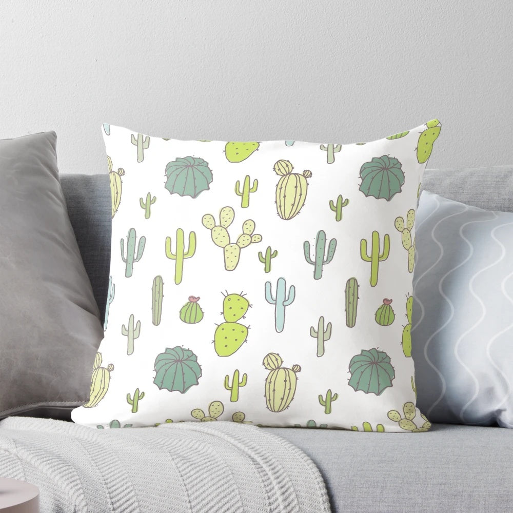 Vibrant cactus print pillow with pink, green, and tropical patterns for a modern, nature-inspired look.