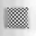 Checkered decorative pillow with a black and white pattern