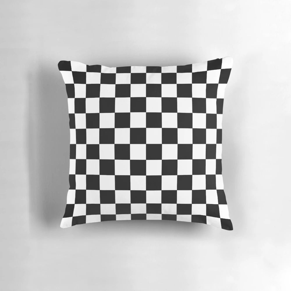 Checkered decorative pillow with a black and white pattern