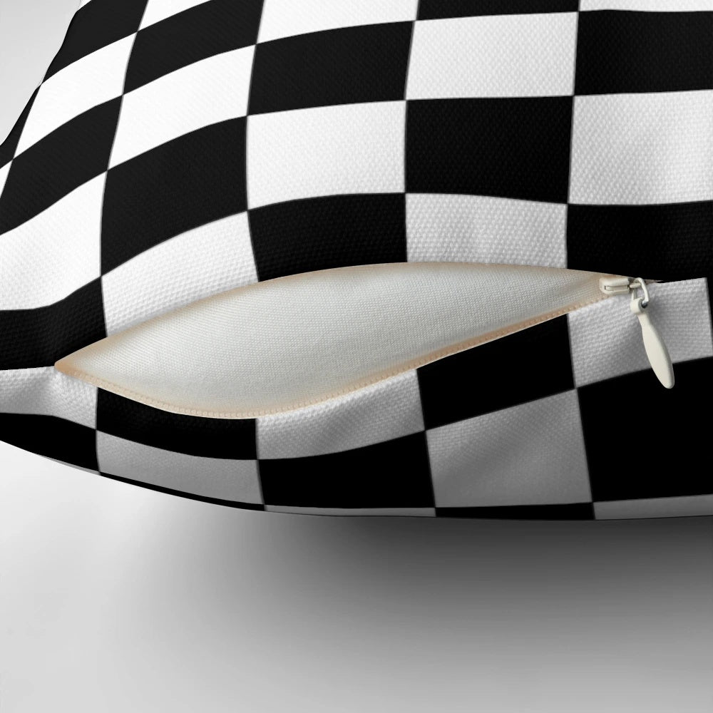 Checkered decorative pillow with a black and white pattern