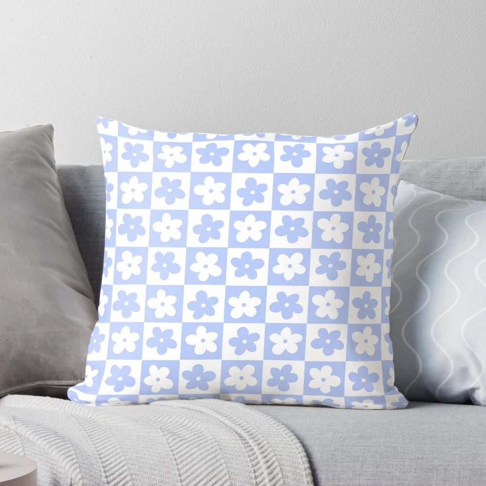 Periwinkle and white checkered pillow with delicate floral pattern