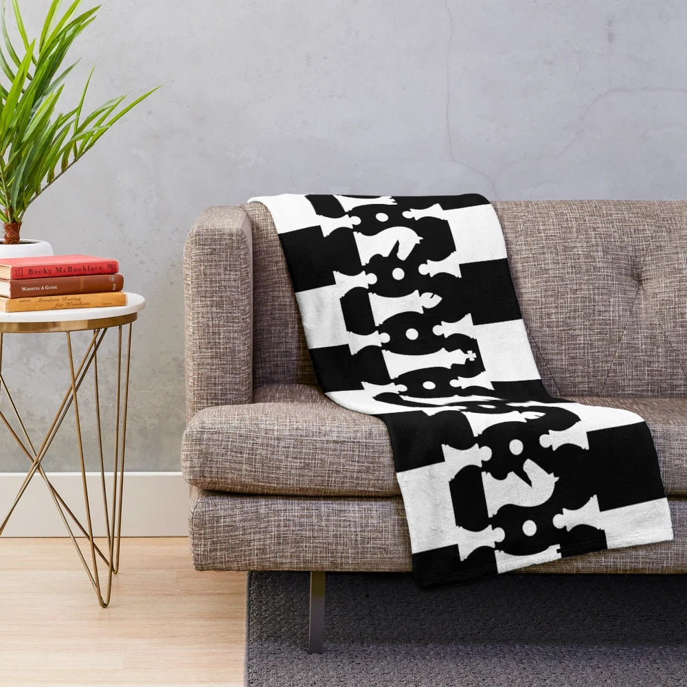 Plush blanket featuring a chess pieces pattern in black and white