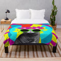 A colorful plush blanket featuring a chinchilla wearing sunglasses and floral accents in a pop art style.