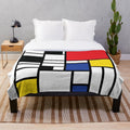 De Stijl inspired plush blanket with primary color block design