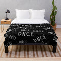 DNCE logo printed on a soft, black and white plush blanket