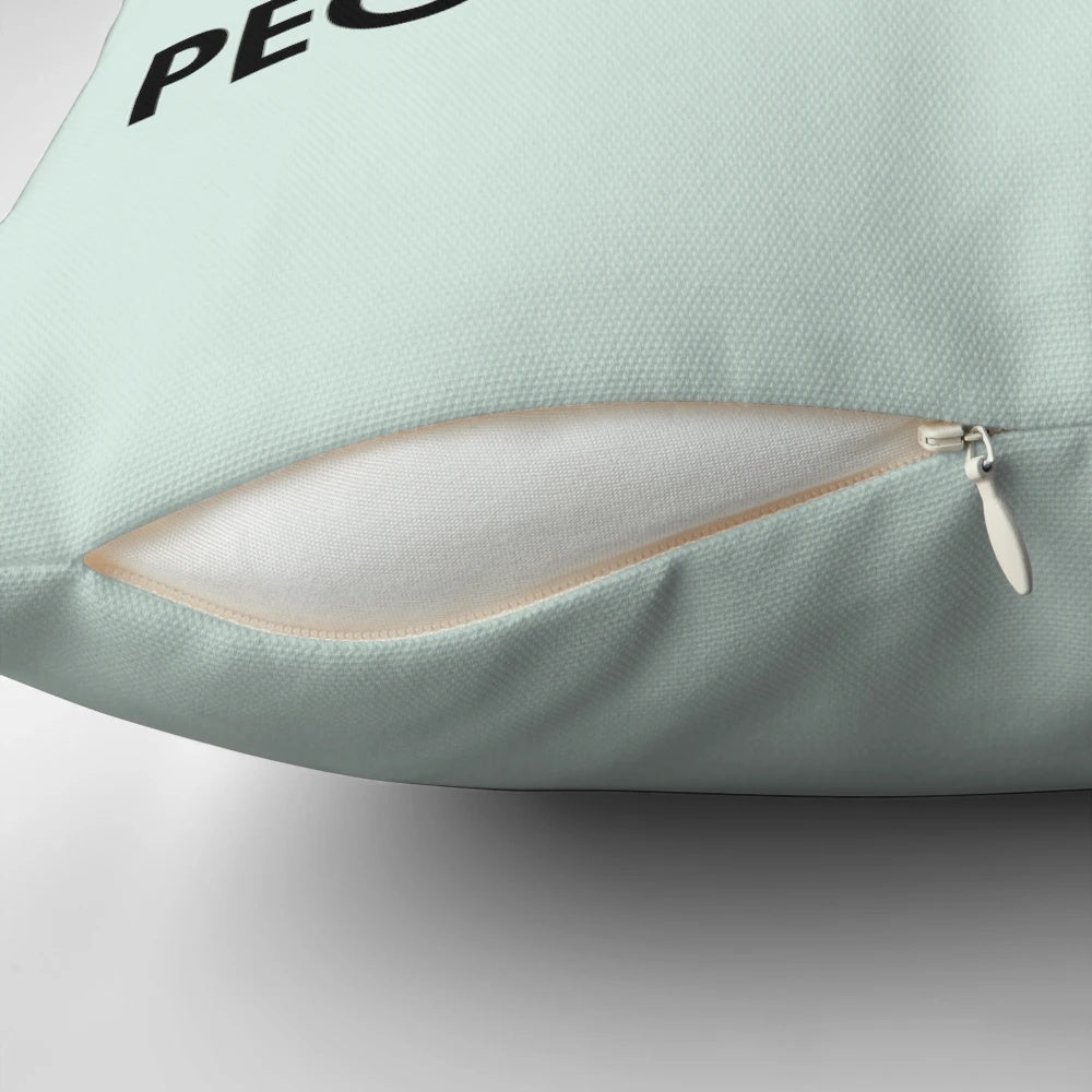 A cozy black pillow with the text "Dogs Welcome, People Tolerated" and a dog paw print design.