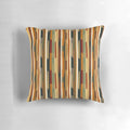An abstract pattern pillow in earthy tones and stripes, a modern and vibrant home decor accent