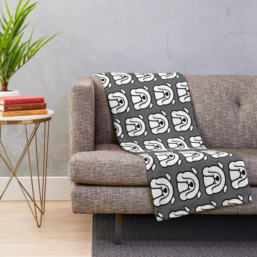 Black and white English bulldog silhouette on a gray plush blanket