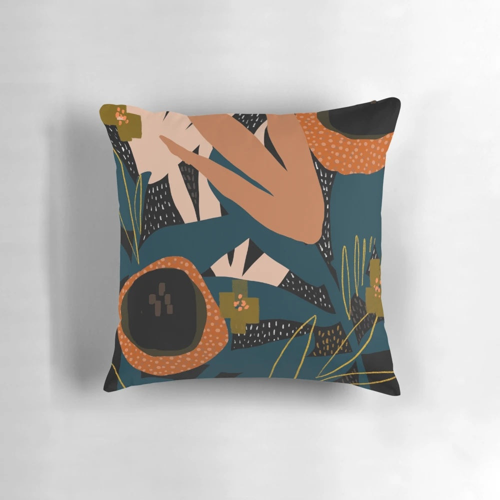 Vibrant evening meadow-inspired pillow with a modern floral pattern in shades of orange and blue.