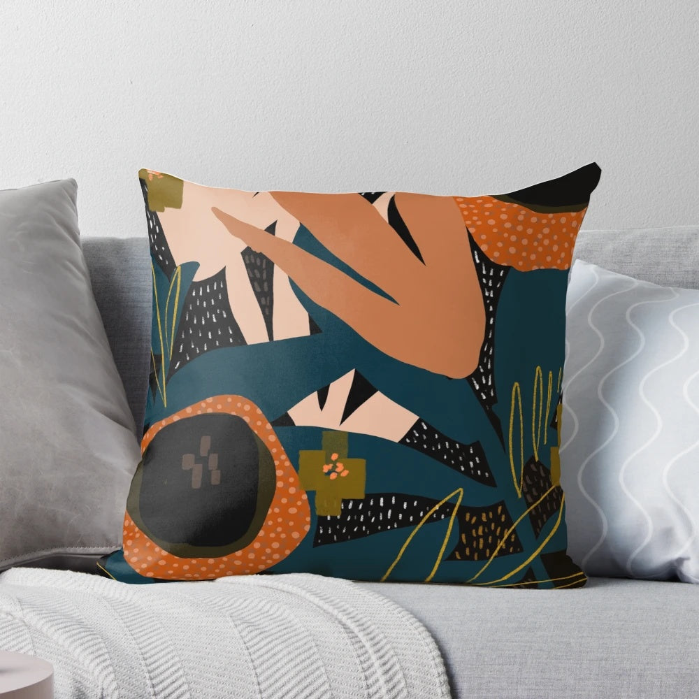 Vibrant evening meadow-inspired pillow with a modern floral pattern in shades of orange and blue.